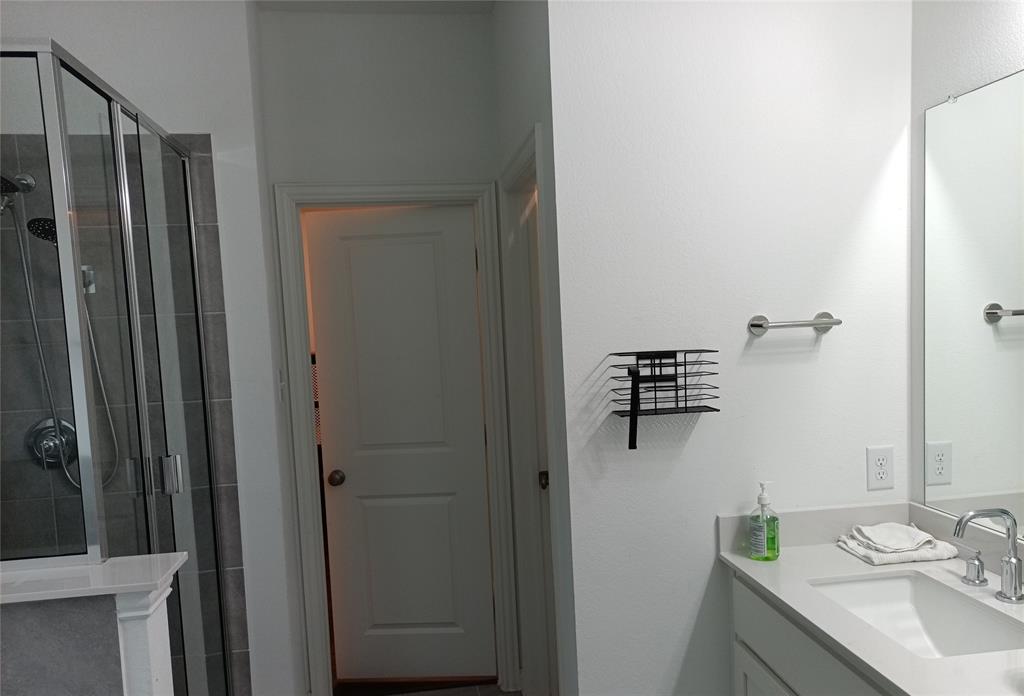 505 Virginia Way Princeton, TX 75407 - Photo 8 of 22 a bathroom with a sink and mirror