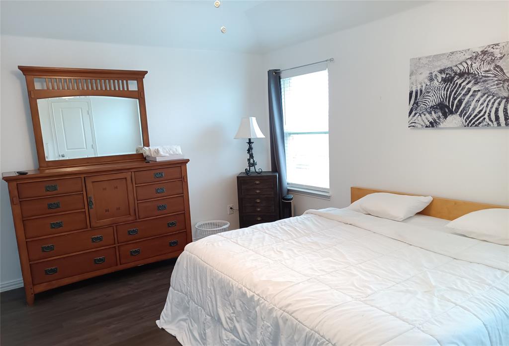 505 Virginia Way Princeton, TX 75407 - Photo 10 of 22 a bedroom with a bed and a dresser