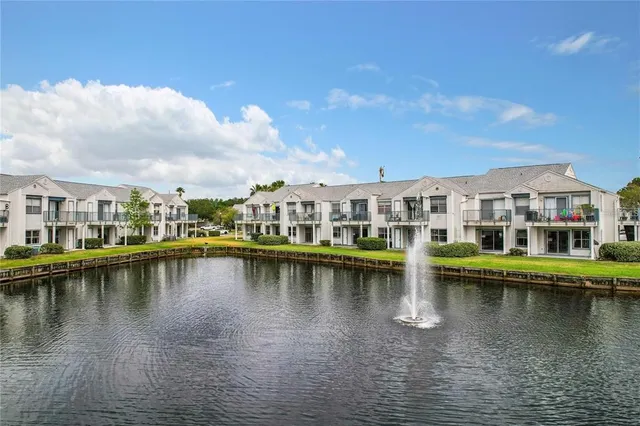 a view of a swimming pool with outdoor seating