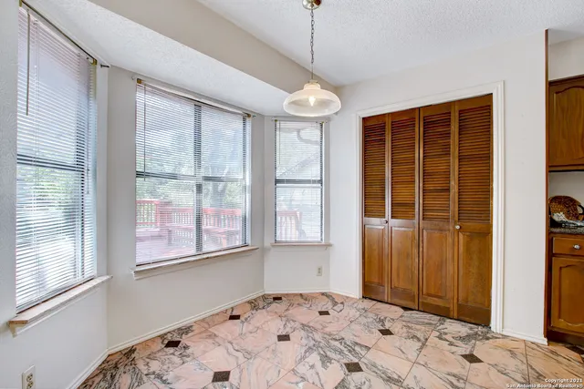 a bedroom with bed and wooden floor