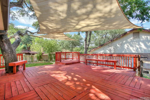 a view of a chairs on wooden deck