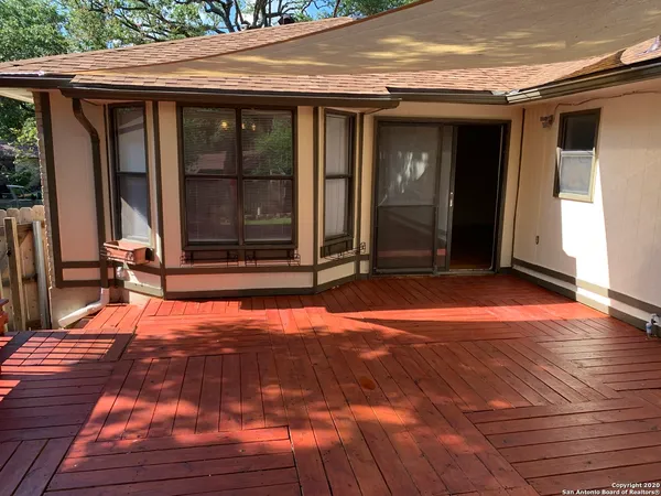 a view of a backyard of the house
