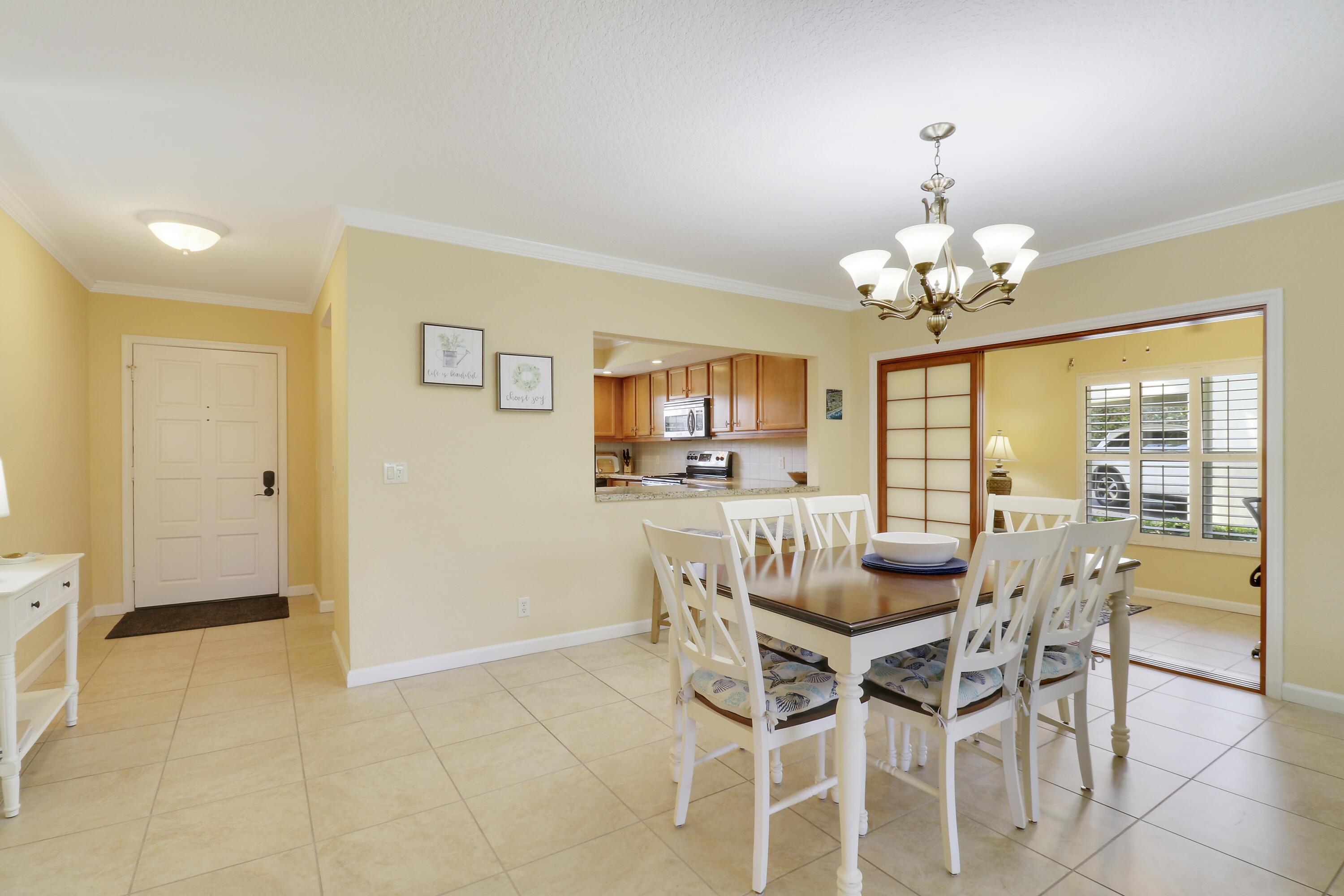 4161 U.S. Highway 1, Unit C2 Jupiter, FL 33477 - Photo 20 of 57 a dining room with furniture and window