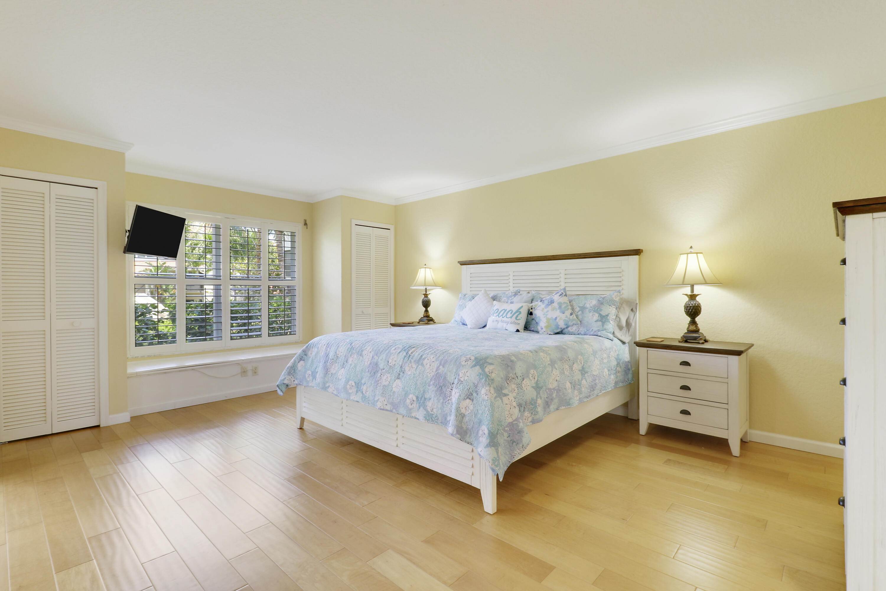 4161 U.S. Highway 1, Unit C2 Jupiter, FL 33477 - Photo 24 of 57 a bedroom with a bed and a window