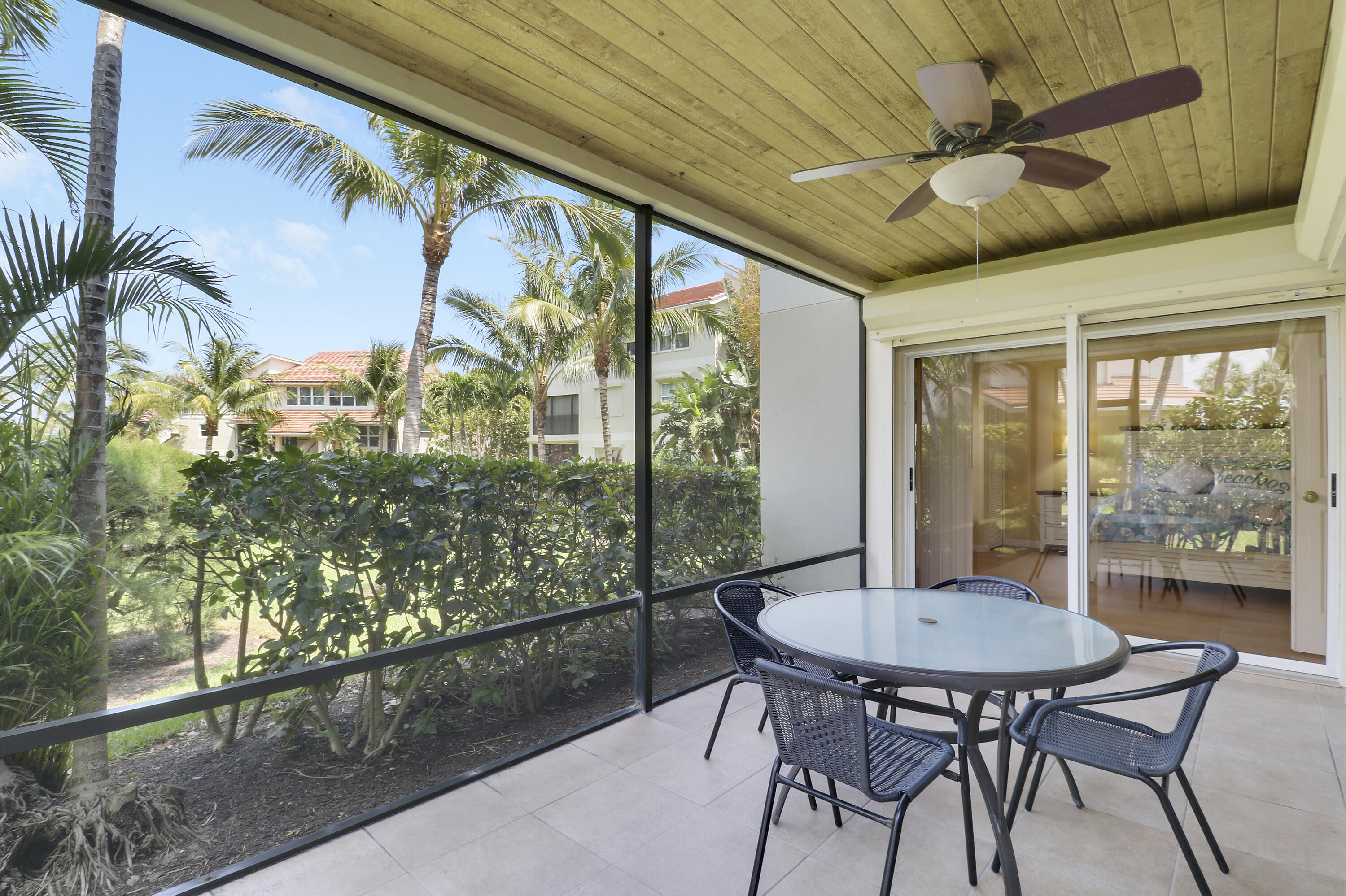 4161 U.S. Highway 1, Unit C2 Jupiter, FL 33477 - Photo 25 of 57 a view of a patio with a table and chairs