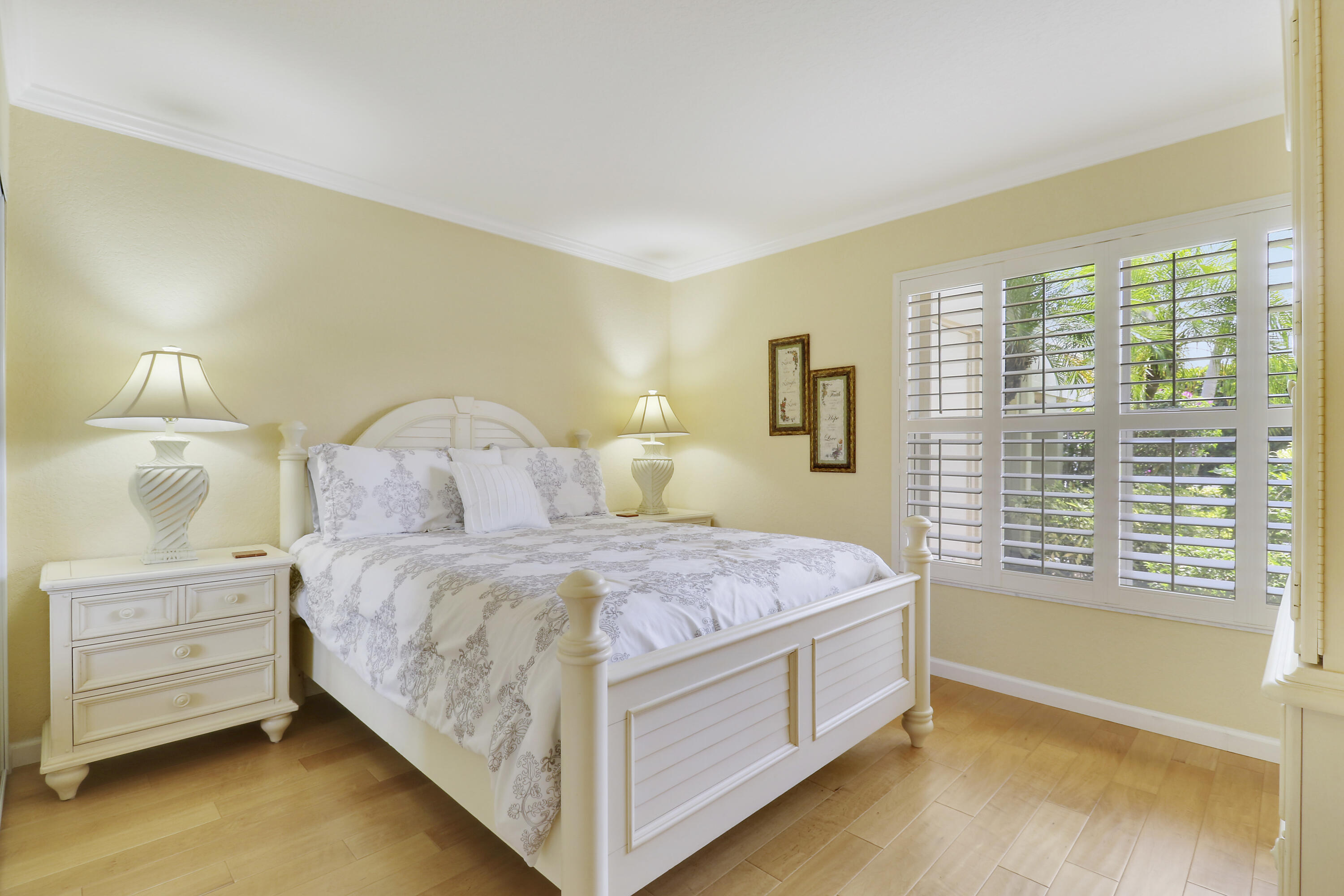 4161 U.S. Highway 1, Unit C2 Jupiter, FL 33477 - Photo 27 of 57 a bedroom with a bed and a night stand