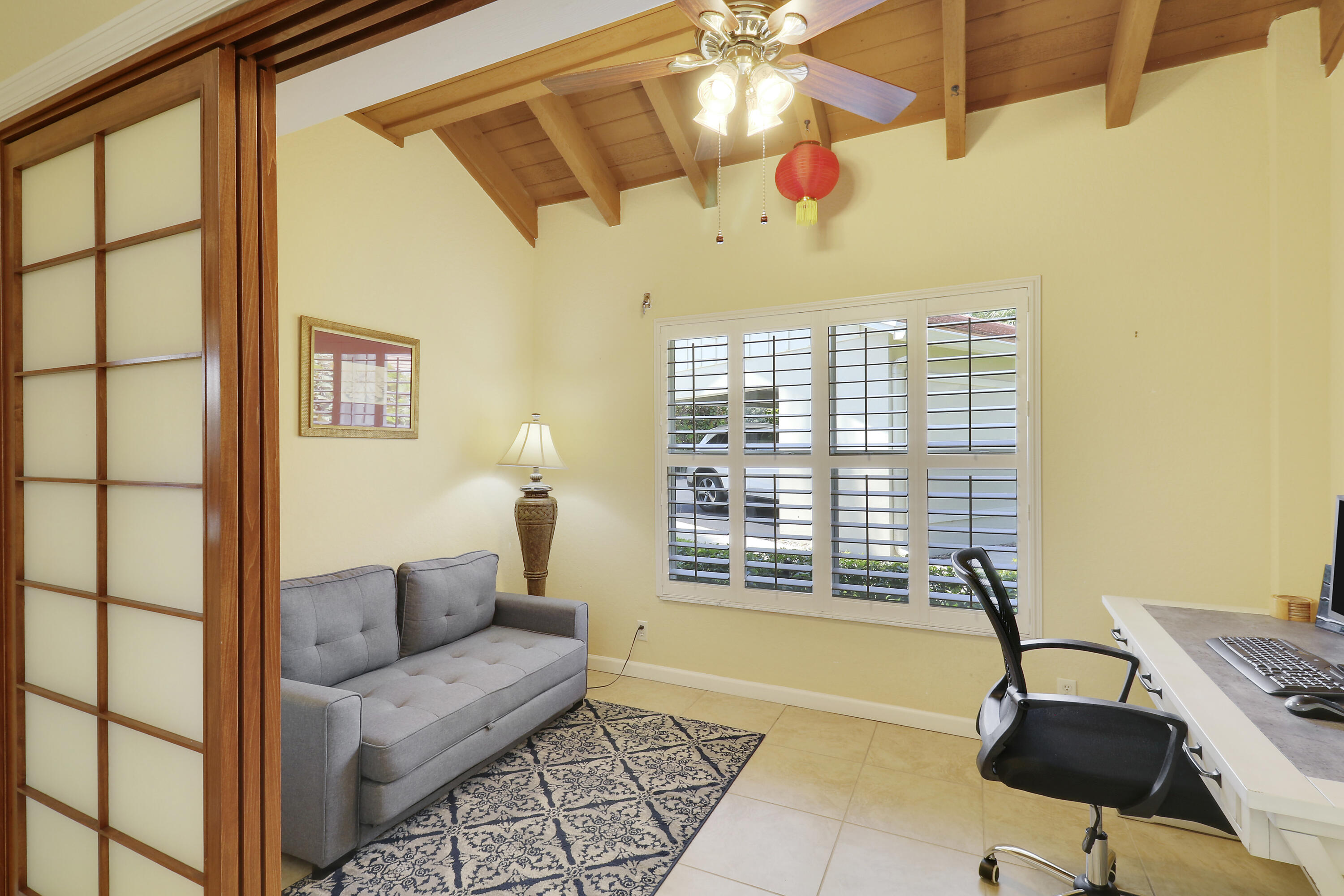 4161 U.S. Highway 1, Unit C2 Jupiter, FL 33477 - Photo 28 of 57 a living room with furniture and a window