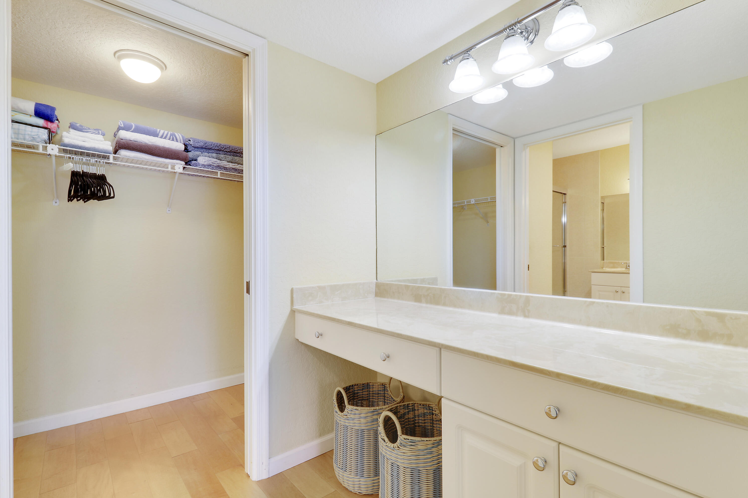4161 U.S. Highway 1, Unit C2 Jupiter, FL 33477 - Photo 33 of 57 a bathroom with a sink a vanity and a mirror