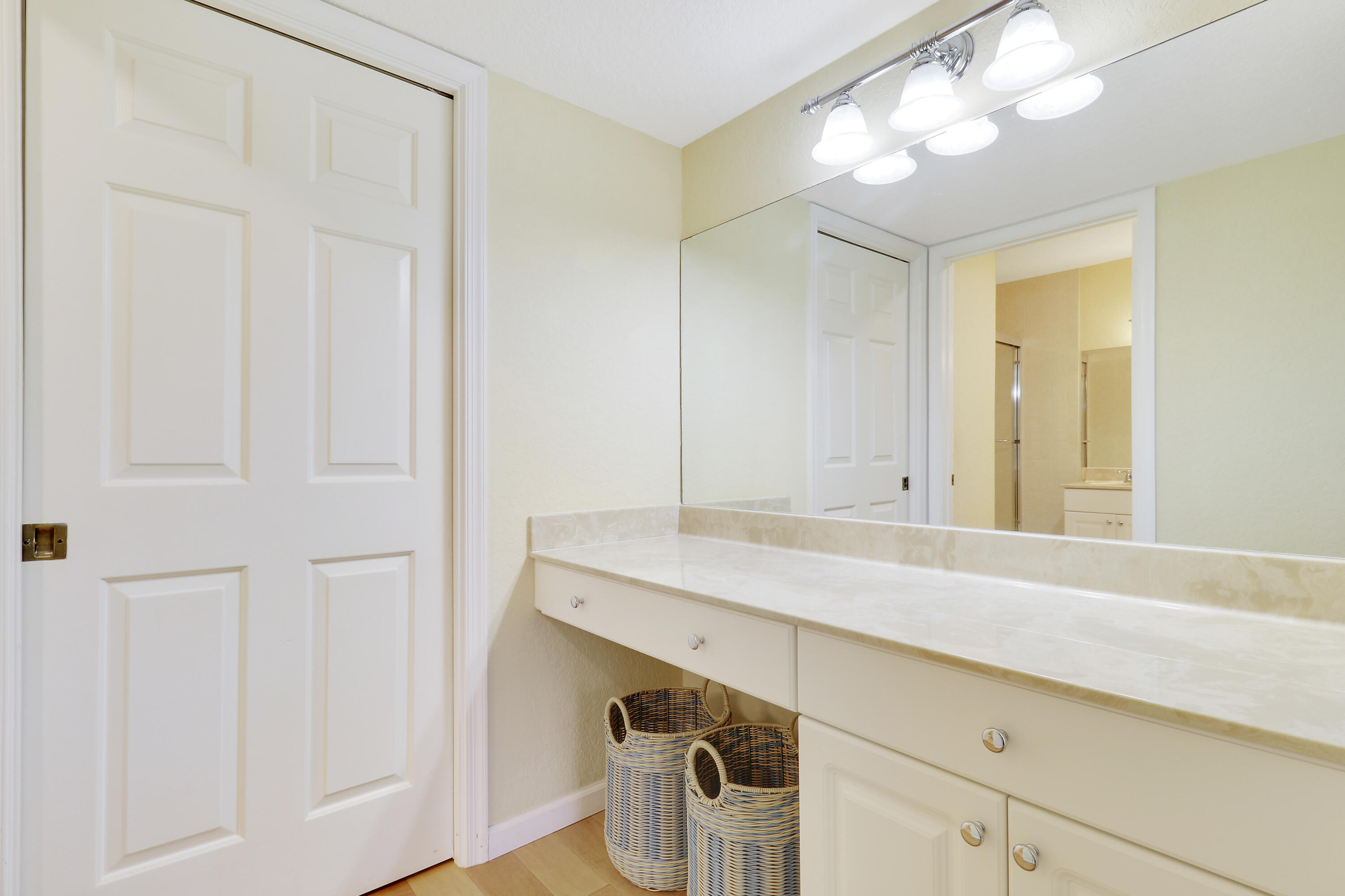 4161 U.S. Highway 1, Unit C2 Jupiter, FL 33477 - Photo 34 of 57 a bathroom with a sink and a mirror