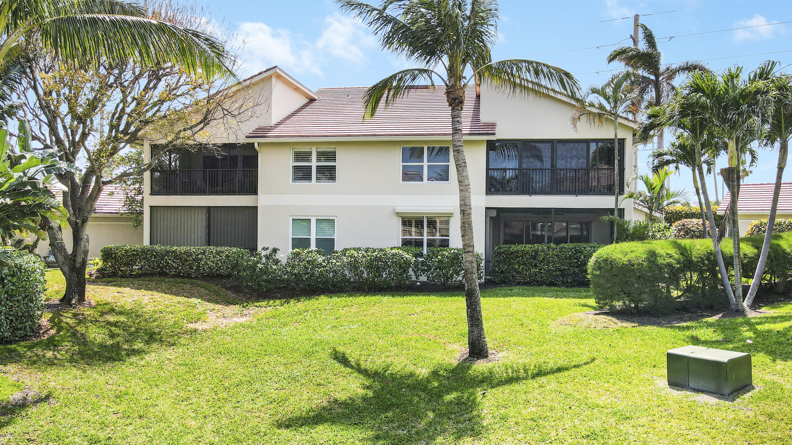4161 U.S. Highway 1, Unit C2 Jupiter, FL 33477 - Photo 37 of 57 a front view of a house with a yard