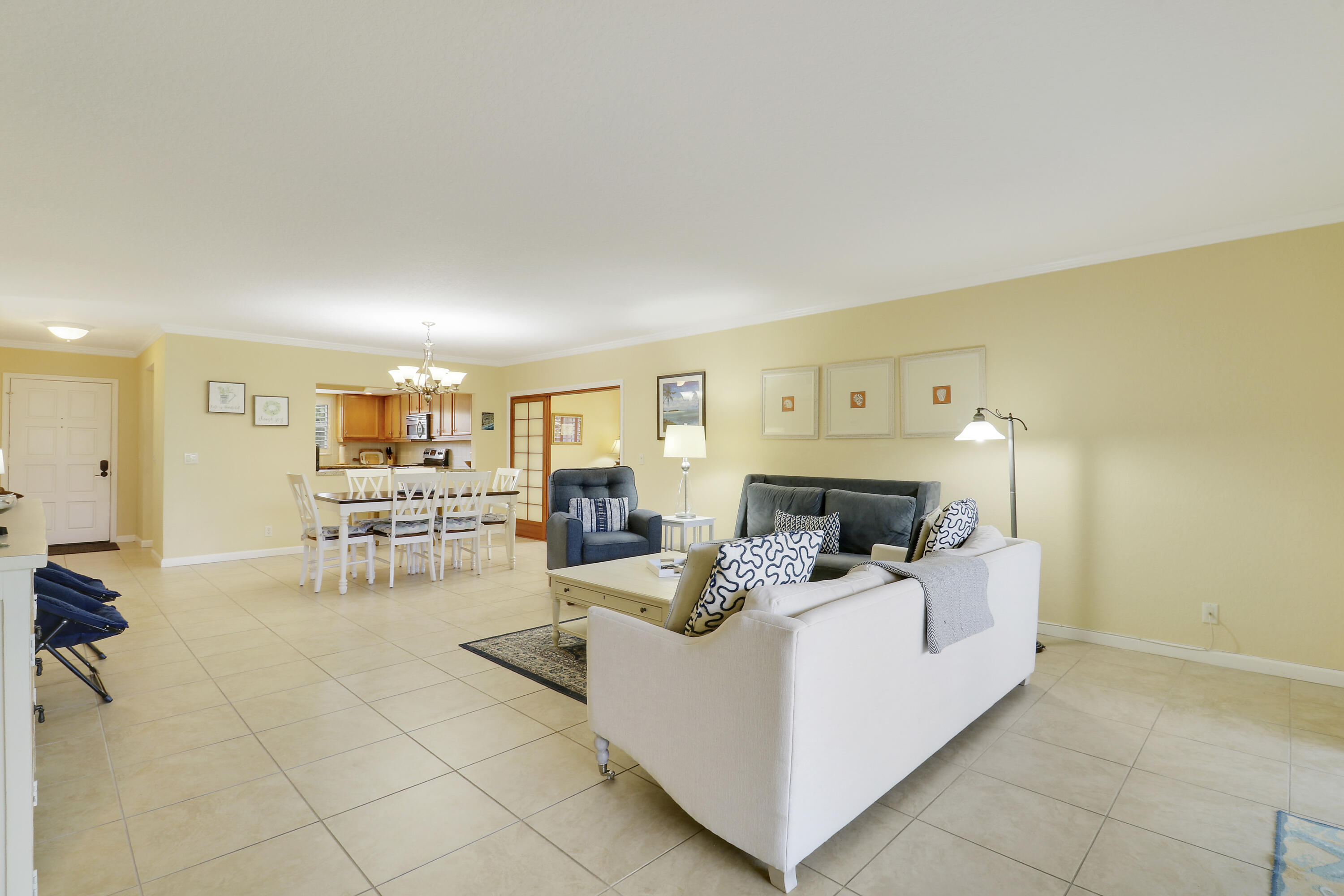 4161 U.S. Highway 1, Unit C2 Jupiter, FL 33477 - Photo 10 of 57 a living room with furniture and a fireplace