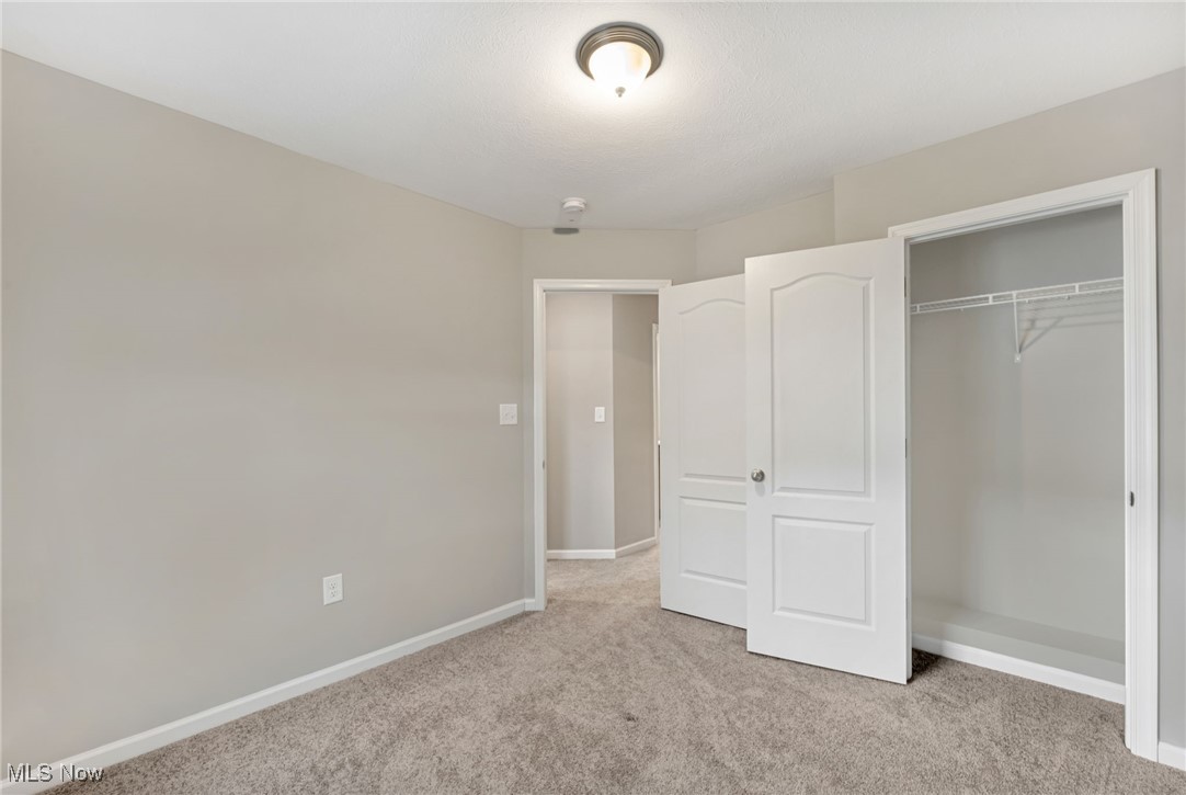 134 Inlet Street Morgantown, WV 26508 - Photo 30 of 44 Unfurnished bedroom with light colored carpet and a closet
