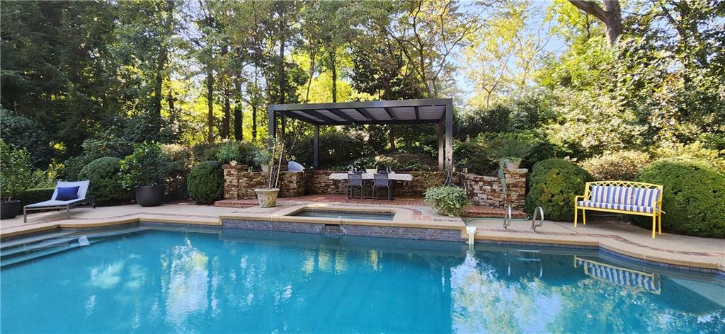 4224 East Conway Drive Northwest Atlanta, GA 30327 - Photo 12 of 72 a small pool with couple of relaxing chair