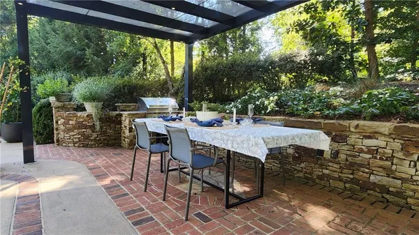 a front view of a house with a yard table and chairs