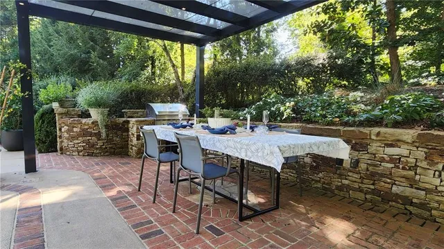 a front view of a house with a yard table and chairs