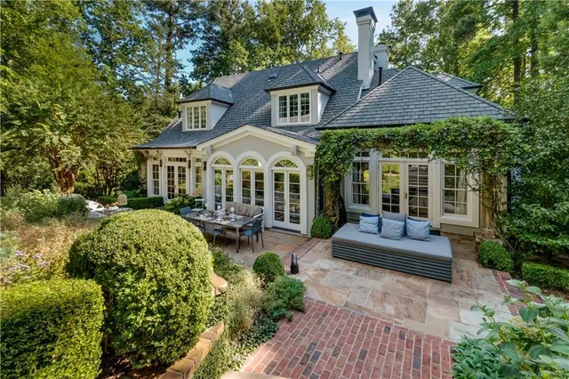 a view of a pathway of a house with a small yard