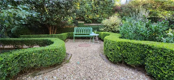 a view of a swimming pool with a yard