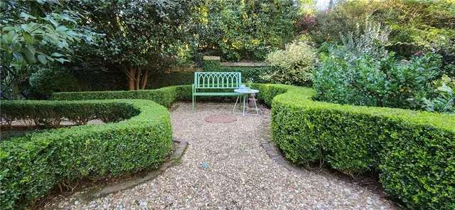 a view of a swimming pool with a yard