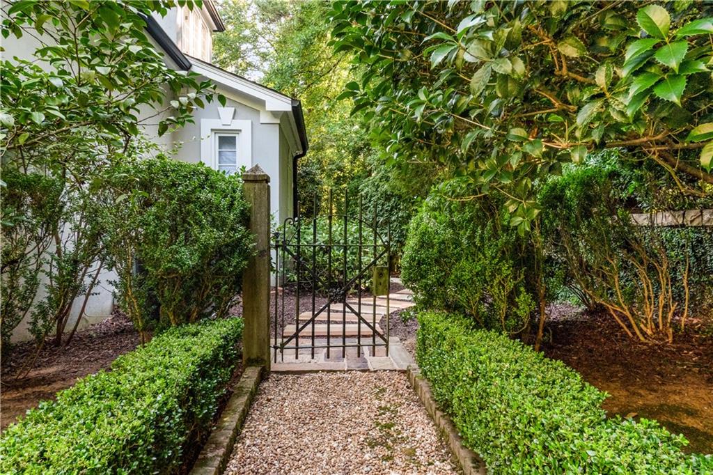 4224 East Conway Drive Northwest Atlanta, GA 30327 - Photo 22 of 72 a view of a pathway of a house with a small yard