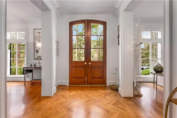 a living room with furniture dining table and a large window