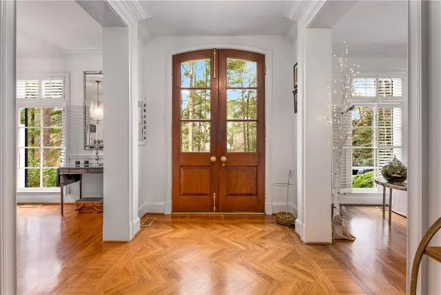 a living room with furniture dining table and a large window