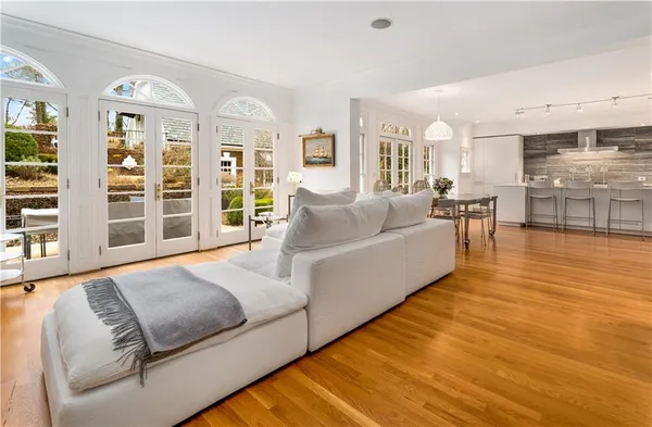 a living room with furniture fireplace and rug