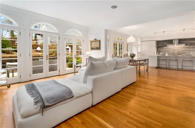 a living room with furniture fireplace and rug
