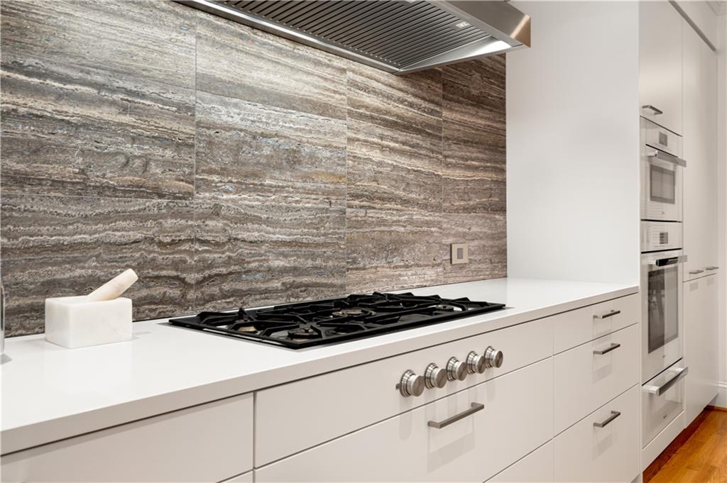 4224 East Conway Drive Northwest Atlanta, GA 30327 - Photo 32 of 72 a stove top oven sitting inside of a kitchen