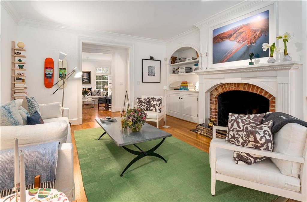 4224 East Conway Drive Northwest Atlanta, GA 30327 - Photo 37 of 72 a living room with furniture and a fireplace