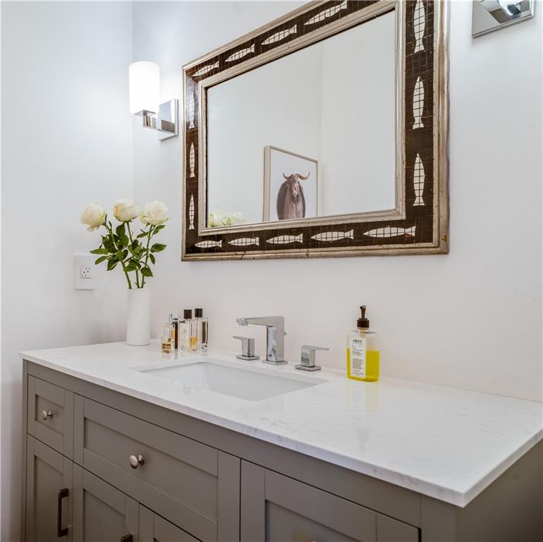 4224 East Conway Drive Northwest Atlanta, GA 30327 - Photo 39 of 72 a bathroom with a sink and a mirror