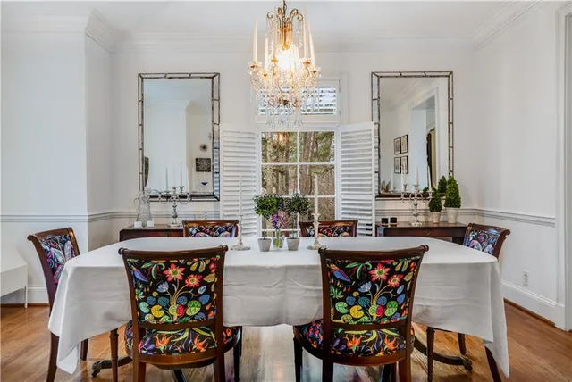 a bathroom with a granite countertop shower a mirror and a sink