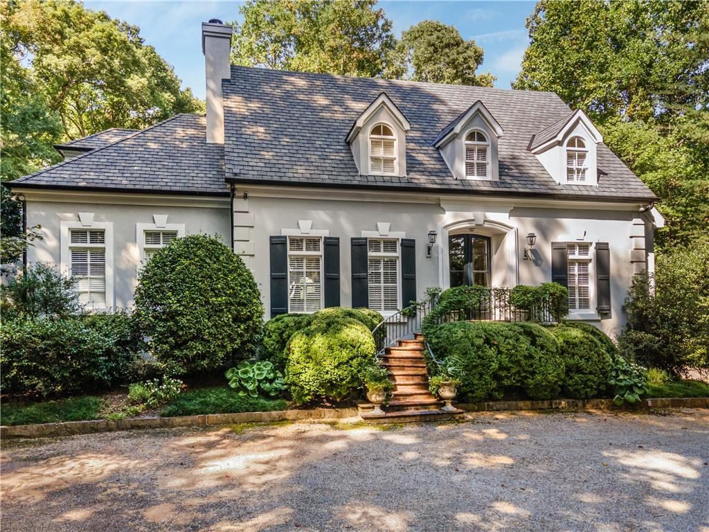4224 East Conway Drive Northwest Atlanta, GA 30327 - Photo 4 of 72 a front view of a house with garden