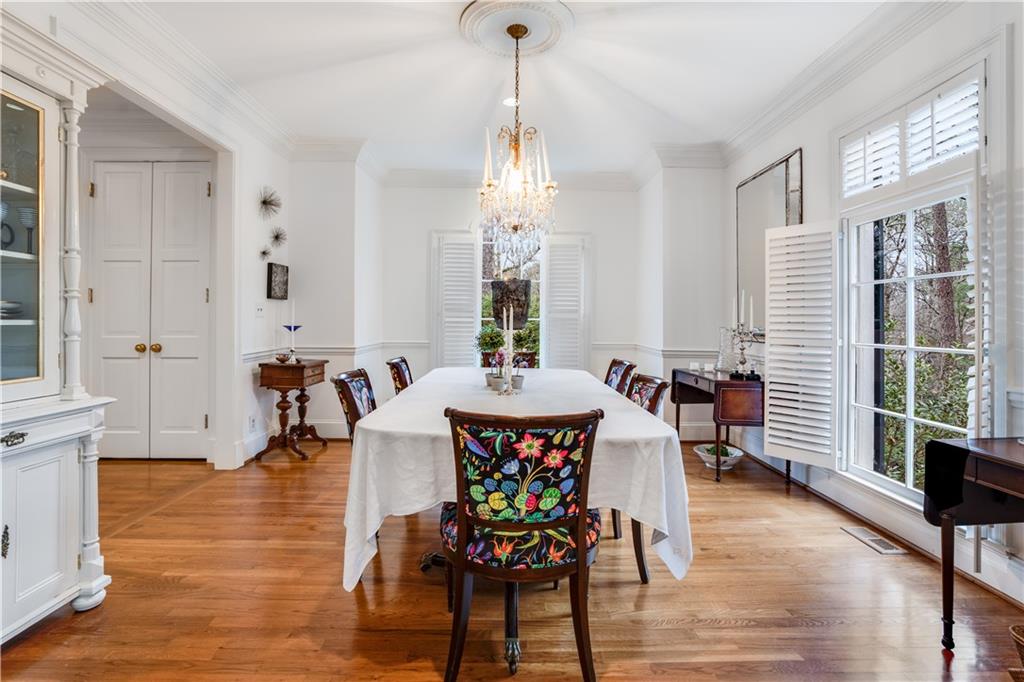 4224 East Conway Drive Northwest Atlanta, GA 30327 - Photo 41 of 72 a view of a dining room with furniture window and wooden floor