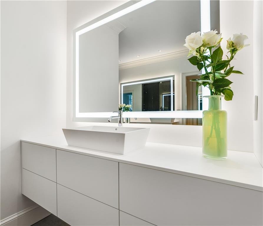 4224 East Conway Drive Northwest Atlanta, GA 30327 - Photo 48 of 72 a bathroom with a sink a vanity and a bathtub