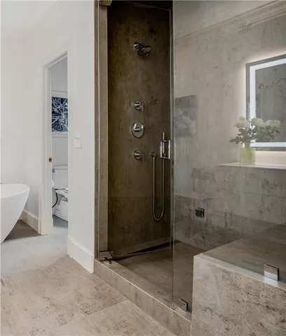 a wooden bench sitting in front of a building