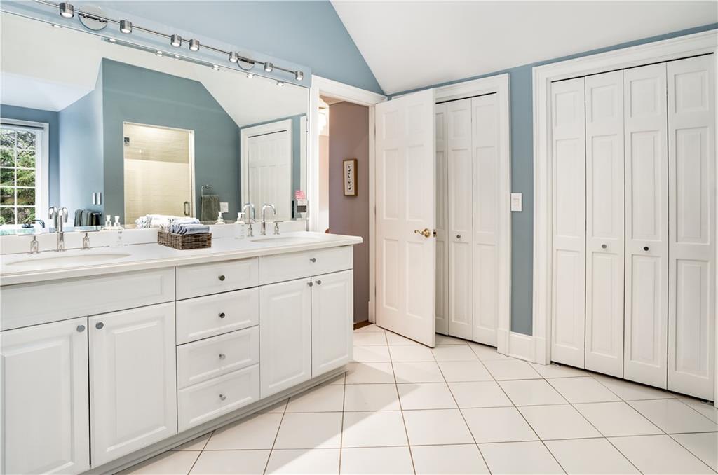 4224 East Conway Drive Northwest Atlanta, GA 30327 - Photo 55 of 72 a bathroom with a double vanity sink mirror and