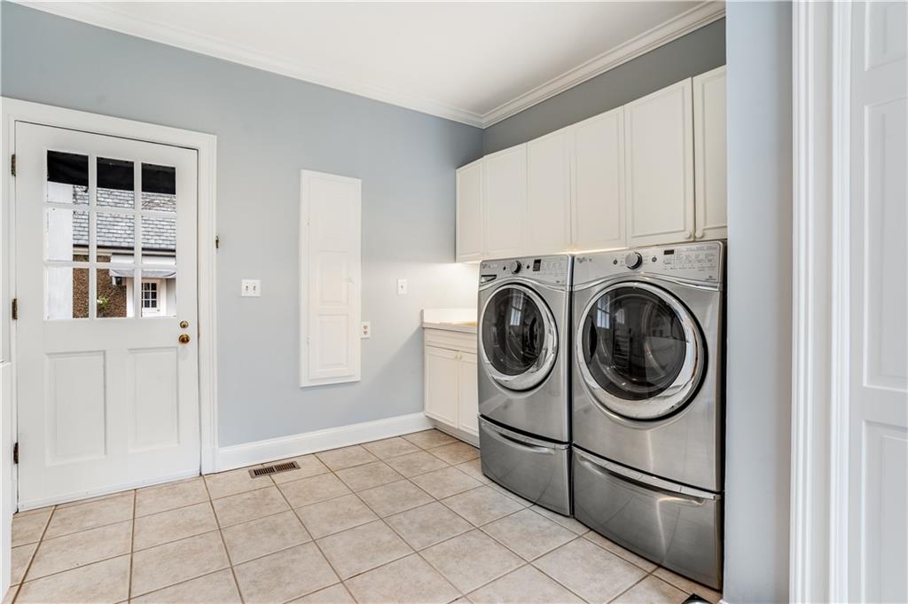 4224 East Conway Drive Northwest Atlanta, GA 30327 - Photo 59 of 72 a view of a storage & utility room with washer and dryer