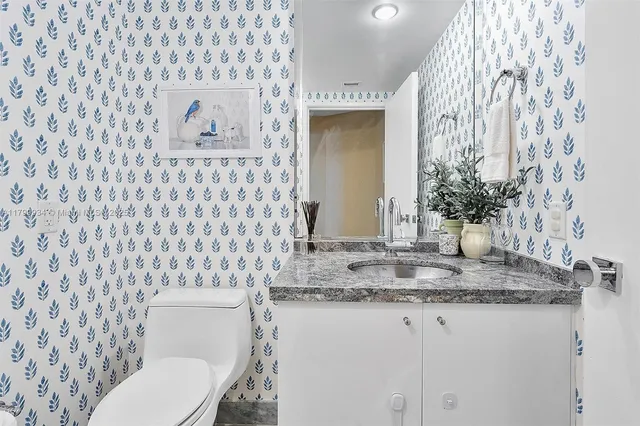 a backyard of a house with a yard and outdoor seating