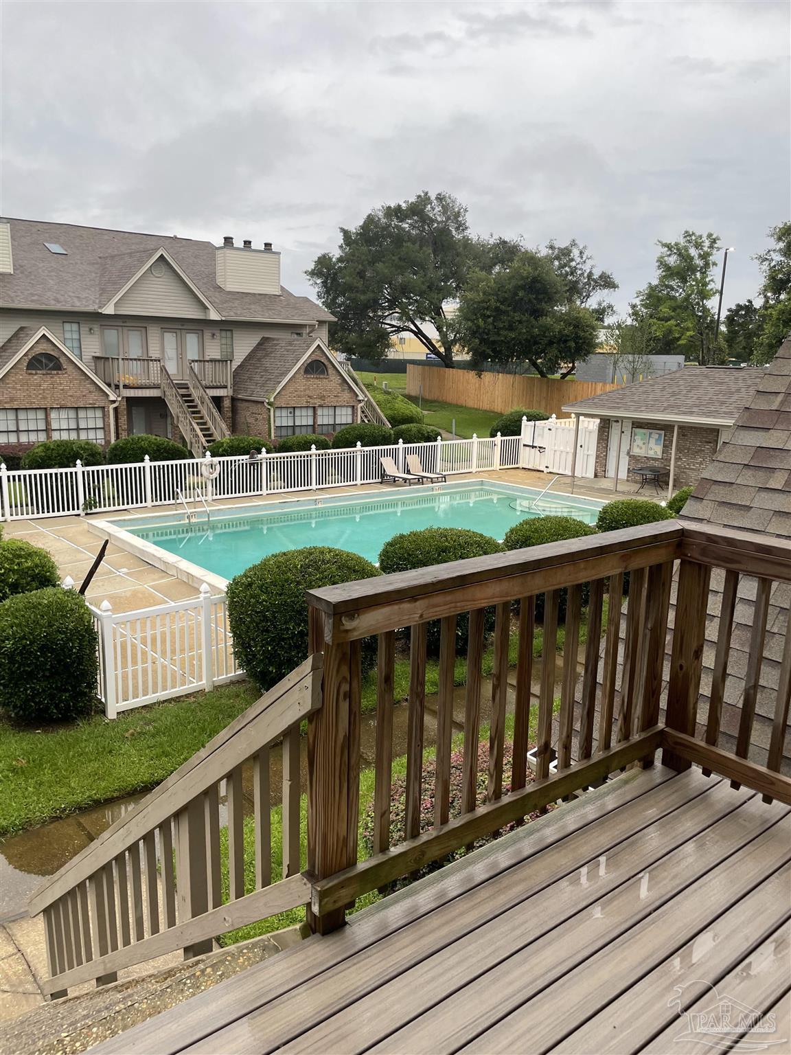 7150 Plantation Road, Unit 327 Pensacola, FL 32504 - Photo 10 of 24 a view of a wooden deck and city view