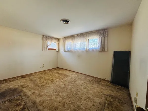 an empty room with windows