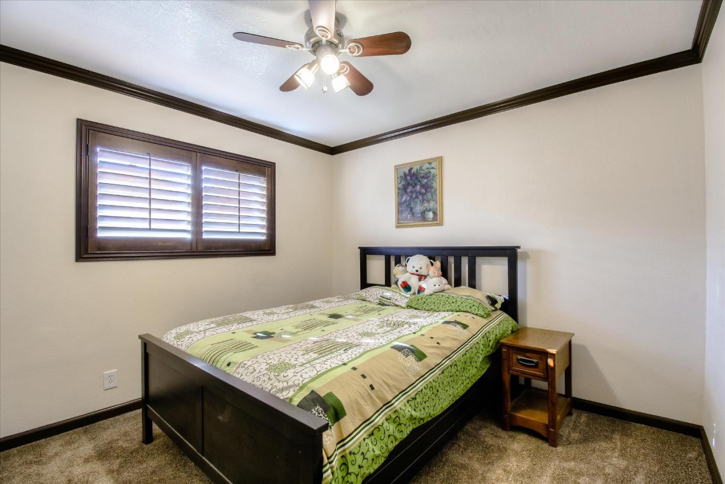 2055 Hogan Drive Santa Clara, CA 95054 - Photo 15 of 37 a bed sitting in a bedroom next to a window