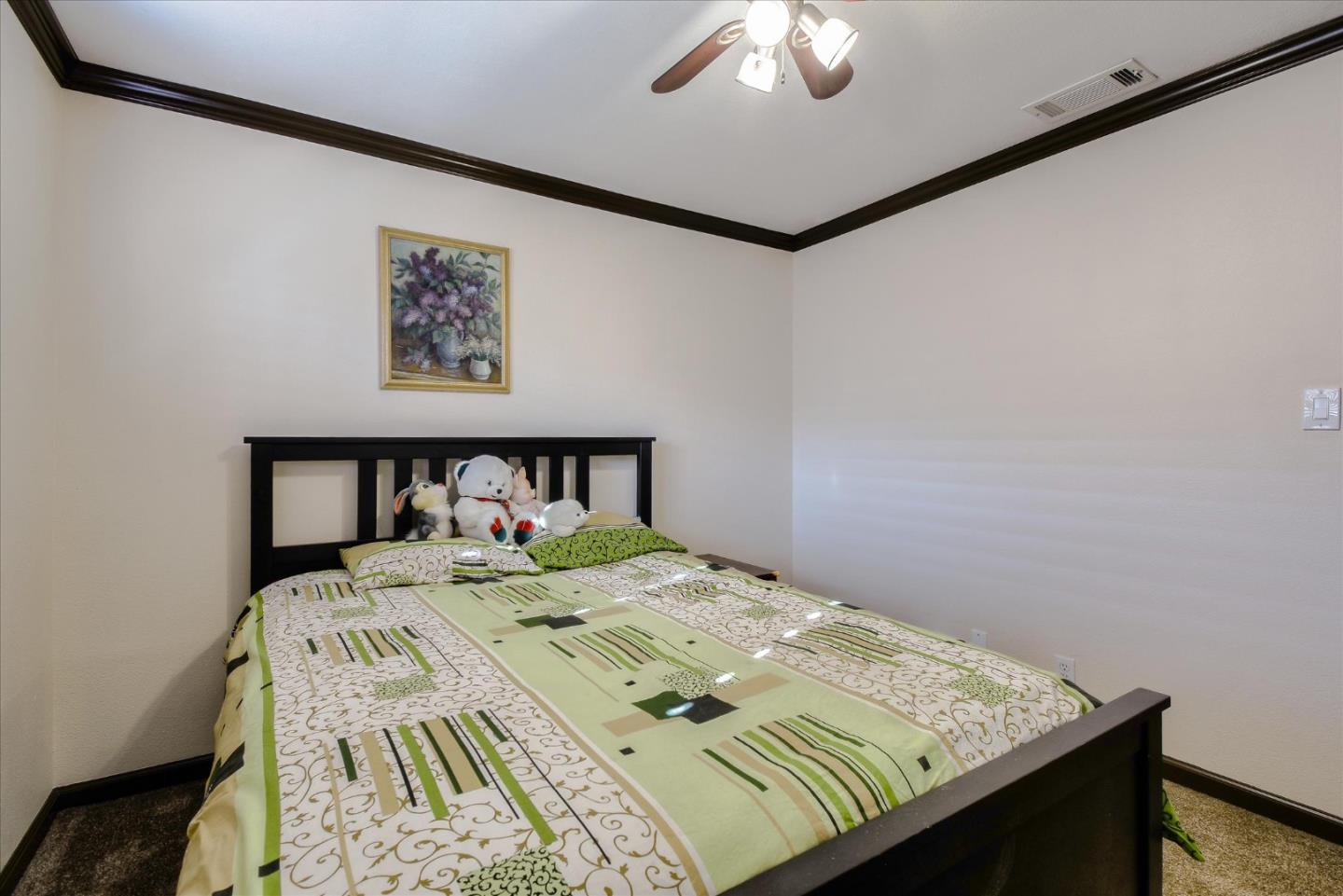 2055 Hogan Drive Santa Clara, CA 95054 - Photo 16 of 37 a bed sitting in a bedroom next to a lamp