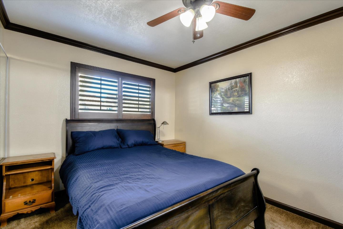 2055 Hogan Drive Santa Clara, CA 95054 - Photo 20 of 37 a bedroom with a bed and a chandelier