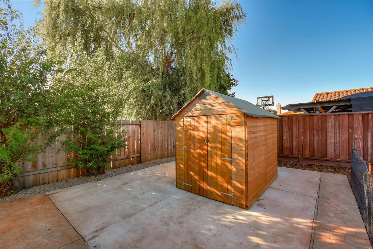 2055 Hogan Drive Santa Clara, CA 95054 - Photo 31 of 37 a view of a wooden fence with a house in the background