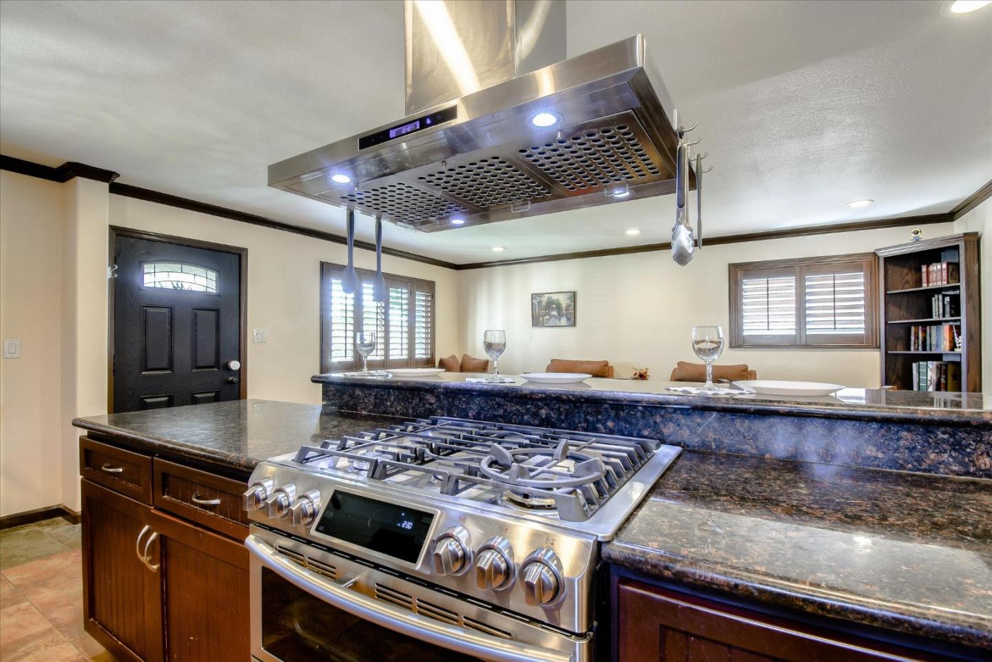 2055 Hogan Drive Santa Clara, CA 95054 - Photo 6 of 37 a kitchen with a stove and a wooden floor