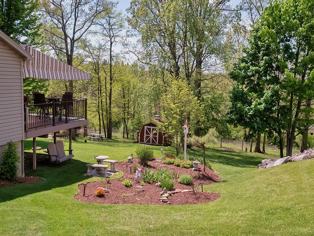 638 Knoll Lane Apollo, PA 15613 - Photo 27 of 30 a view of a backyard with a garden and fire pit