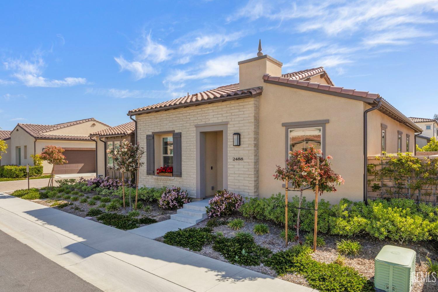 Undisclosed Address Camarillo, CA 93012 - Photo 3 of 54 a front view of a house with garden