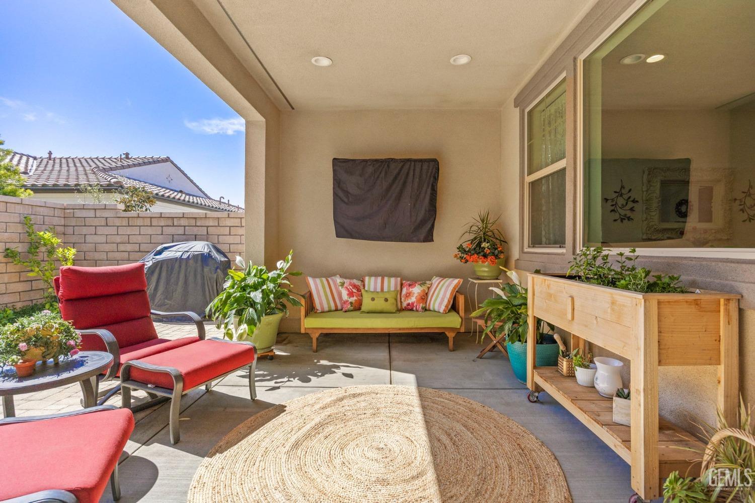 Undisclosed Address Camarillo, CA 93012 - Photo 35 of 54 a living room with furniture a rug and a table