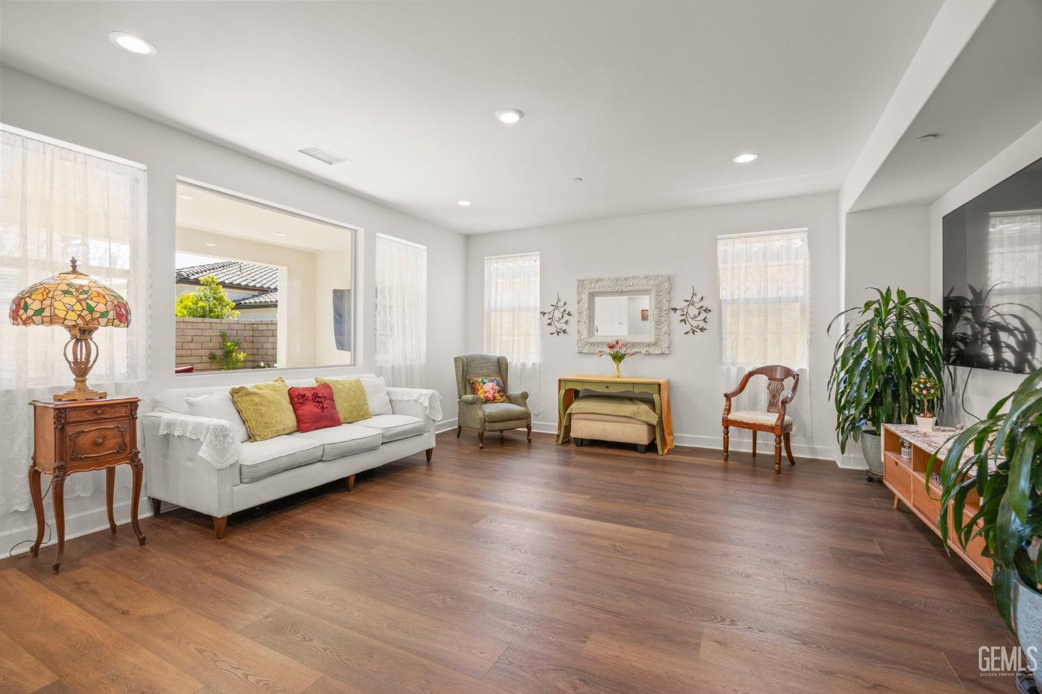 Undisclosed Address Camarillo, CA 93012 - Photo 8 of 54 a living room with furniture and a wooden floor