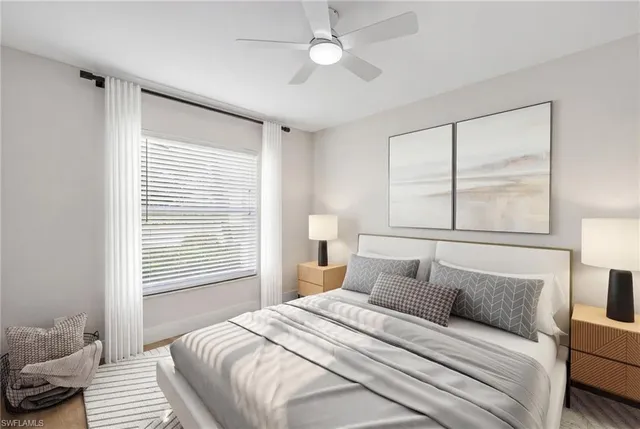 a bedroom with a large bed and a window